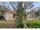 The home features a backyard with lush plants at 820 Cypress Oak Cir, Deland, FL 32720