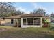 The backyard features a patio and well maintained grass at 820 Cypress Oak Cir, Deland, FL 32720