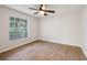 Comfortable bedroom featuring a ceiling fan and a bright window at 820 Cypress Oak Cir, Deland, FL 32720