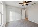 The bedroom features neutral walls, carpet, a ceiling fan, and a closet with white doors at 820 Cypress Oak Cir, Deland, FL 32720