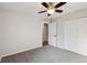 This bedroom features neutral walls, carpet, and closet with white doors at 820 Cypress Oak Cir, Deland, FL 32720
