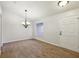 Well-lit dining room with wood-look tile floors and a stylish chandelier at 820 Cypress Oak Cir, Deland, FL 32720