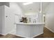Bright kitchen with breakfast bar, stainless steel appliances, and an open floor plan at 820 Cypress Oak Cir, Deland, FL 32720