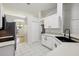 Open kitchen view with stainless steel refrigerator, and breakfast bar looking out at a dining area at 820 Cypress Oak Cir, Deland, FL 32720