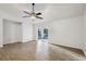 Bright living room with access to screened-in porch and neutral color palette at 820 Cypress Oak Cir, Deland, FL 32720