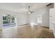 Spacious living room featuring sliding glass doors and neutral wall paint at 820 Cypress Oak Cir, Deland, FL 32720