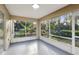 The screened porch offers views of lush landscaping and plenty of natural light at 820 Cypress Oak Cir, Deland, FL 32720