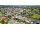 Aerial shot highlighting the home's location within a neighborhood with mature trees and amenities at 8515 Morehouse Dr, Orlando, FL 32836