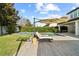Inviting backyard features a pool, lounge chairs, green lawn, and mature landscaping for outdoor enjoyment at 8515 Morehouse Dr, Orlando, FL 32836