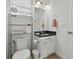 Cozy half bathroom features sleek fixtures, a decorative mirror, and ample storage space at 8515 Morehouse Dr, Orlando, FL 32836