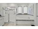 Clean bathroom with a soaking tub and shower with glass door at 8515 Morehouse Dr, Orlando, FL 32836