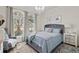 Cozy bedroom featuring lots of natural light and a chandelier at 8515 Morehouse Dr, Orlando, FL 32836