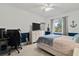Modern bedroom with a light colored walls, musical themed decorations, and comfortable bed at 8515 Morehouse Dr, Orlando, FL 32836