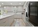 Modern kitchen featuring an island, lots of counterspace and stainless steel refrigerator at 8515 Morehouse Dr, Orlando, FL 32836