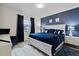 Comfortable main bedroom features a plush bed, stylish decor, and ample natural light at 8515 Morehouse Dr, Orlando, FL 32836
