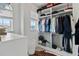 Spacious walk-in closet with custom shelving, hanging racks, and natural light at 8515 Morehouse Dr, Orlando, FL 32836
