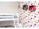 ' room with Mickey Mouse themed wallpaper and a bunk bed at 8988 Cabot Cliffs Dr, Champions Gate, FL 33896