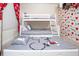 A bedroom featuring a bunk bed with Mickey Mouse sheets and playful décor at 8988 Cabot Cliffs Dr, Champions Gate, FL 33896