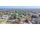 Aerial view of the neighborhood, showcasing tree coverage and proximity to community areas at 9350 2Nd Ave, Orlando, FL 32824