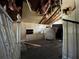 Damaged attic space with stairs and exposed insulation offering an opportunity for renovation and customization at 9350 2Nd Ave, Orlando, FL 32824