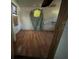 Bedroom featuring wood floors and walls in need of repair at 9350 2Nd Ave, Orlando, FL 32824
