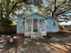 Charming exterior of a single-Gathering home with a small front porch and mature trees at 9350 2Nd Ave, Orlando, FL 32824