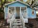 Quaint single-Gathering home with a charming porch and a welcoming entrance at 9350 2Nd Ave, Orlando, FL 32824