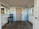 Inviting front porch with a chair and an entrance door at 9350 2Nd Ave, Orlando, FL 32824