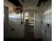Interior of damaged house, looking through door at 9350 2Nd Ave, Orlando, FL 32824