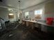 Interior of a kitchen with a sink and damage to the floors at 9350 2Nd Ave, Orlando, FL 32824