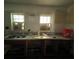 Renovation ready kitchen with a double sink and two windows at 9350 2Nd Ave, Orlando, FL 32824