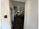 Interior view of a living room with damaged floors and a spiral staircase at 9350 2Nd Ave, Orlando, FL 32824