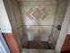 Close up interior of a shower with built in seats and tile at 9350 2Nd Ave, Orlando, FL 32824