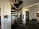 Spiral staircase leading to the second level needs major renovation at 9350 2Nd Ave, Orlando, FL 32824
