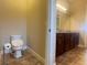 Bathroom featuring a toilet and vanity with a granite countertop at 9526 Lake Hugh Dr, Gotha, FL 34734