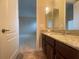 Bathroom featuring a sink with granite countertops and a mirror at 9526 Lake Hugh Dr, Gotha, FL 34734