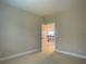 Bedroom with open doorway showing stairway with decorative wrought iron spindles at 9526 Lake Hugh Dr, Gotha, FL 34734
