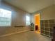 Bonus room featuring two windows, neutral walls, carpet, and doorway at 9526 Lake Hugh Dr, Gotha, FL 34734