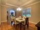 Well-lit dining room featuring hardwood floors and contemporary decor for comfortable dining at 9526 Lake Hugh Dr, Gotha, FL 34734