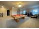 Loft with a pool table, carpeted floors, and view to living space at 9526 Lake Hugh Dr, Gotha, FL 34734