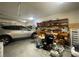 Spacious garage with ample storage space, organizational shelving, and room for multiple vehicles at 9526 Lake Hugh Dr, Gotha, FL 34734