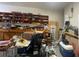 Cluttered garage with lots of shelves and plenty of storage space, appearing in need of organization at 9526 Lake Hugh Dr, Gotha, FL 34734