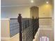 Hallway with decorative wrought iron spindles and an arched doorway at 9526 Lake Hugh Dr, Gotha, FL 34734