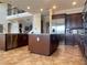Spacious kitchen with stainless steel appliances, granite countertops, island, and ample cabinet space at 9526 Lake Hugh Dr, Gotha, FL 34734