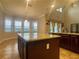 Spacious kitchen with granite countertops and a center island provides ample space at 9526 Lake Hugh Dr, Gotha, FL 34734