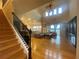 Spacious living room with high ceilings, hardwood floors, staircase, and open floor plan at 9526 Lake Hugh Dr, Gotha, FL 34734
