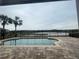 Enjoy the view of the lake from the pool area, which is an outdoor oasis perfect for relaxation and entertainment at 9526 Lake Hugh Dr, Gotha, FL 34734