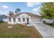 Charming single-story home featuring a well-maintained lawn and a two-car garage at 962 Nancy Ct, Kissimmee, FL 34759