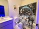 Star Wars themed bathroom features a shower curtain with Star Wars design, a toilet, and a sink at 10437 Ebb Tide Ln, Orlando, FL 32821