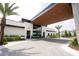 Welcoming building entrance with modern architecture, manicured landscaping, and clear signage at 10437 Ebb Tide Ln, Orlando, FL 32821